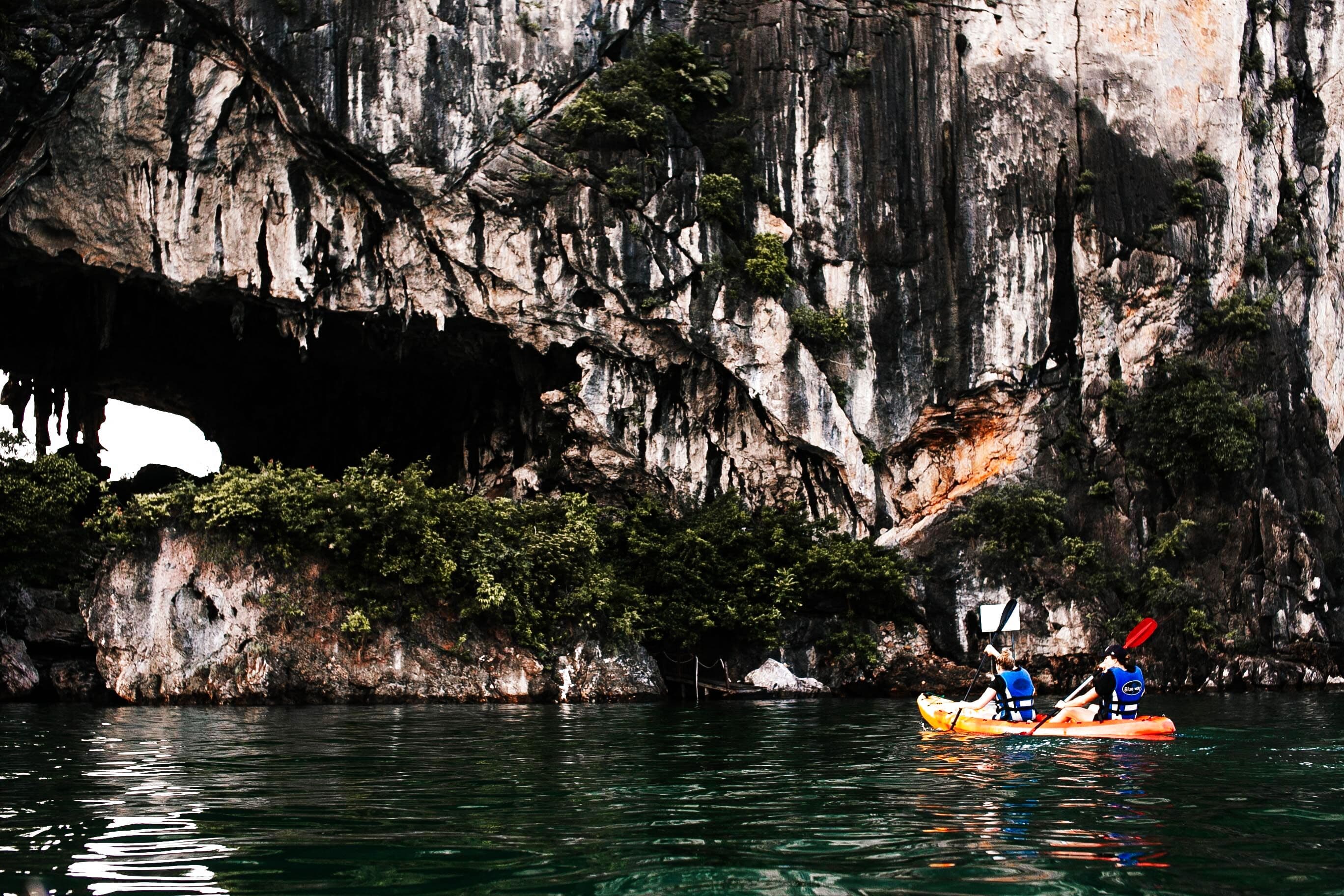 Sea kayaking through limestone sea caves, Krabi